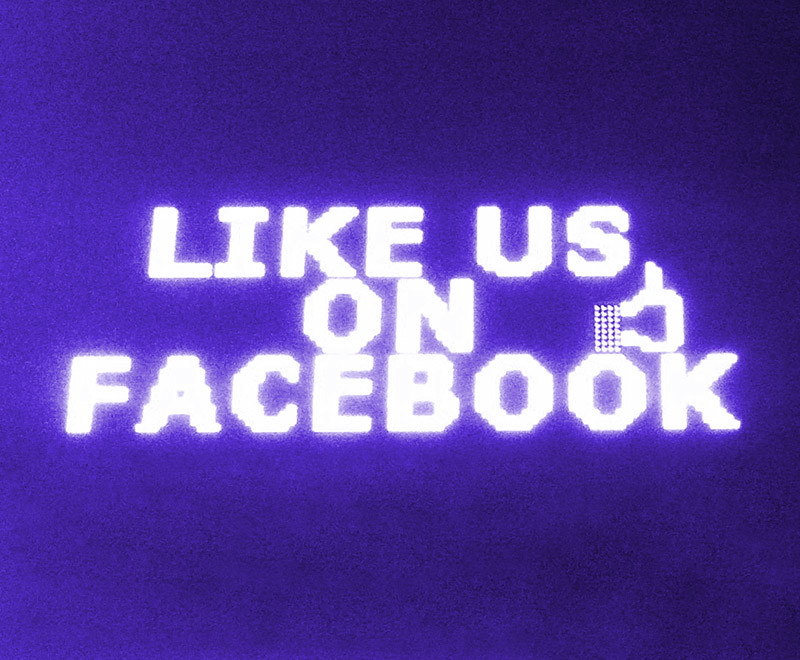 Like us on Facebook signage